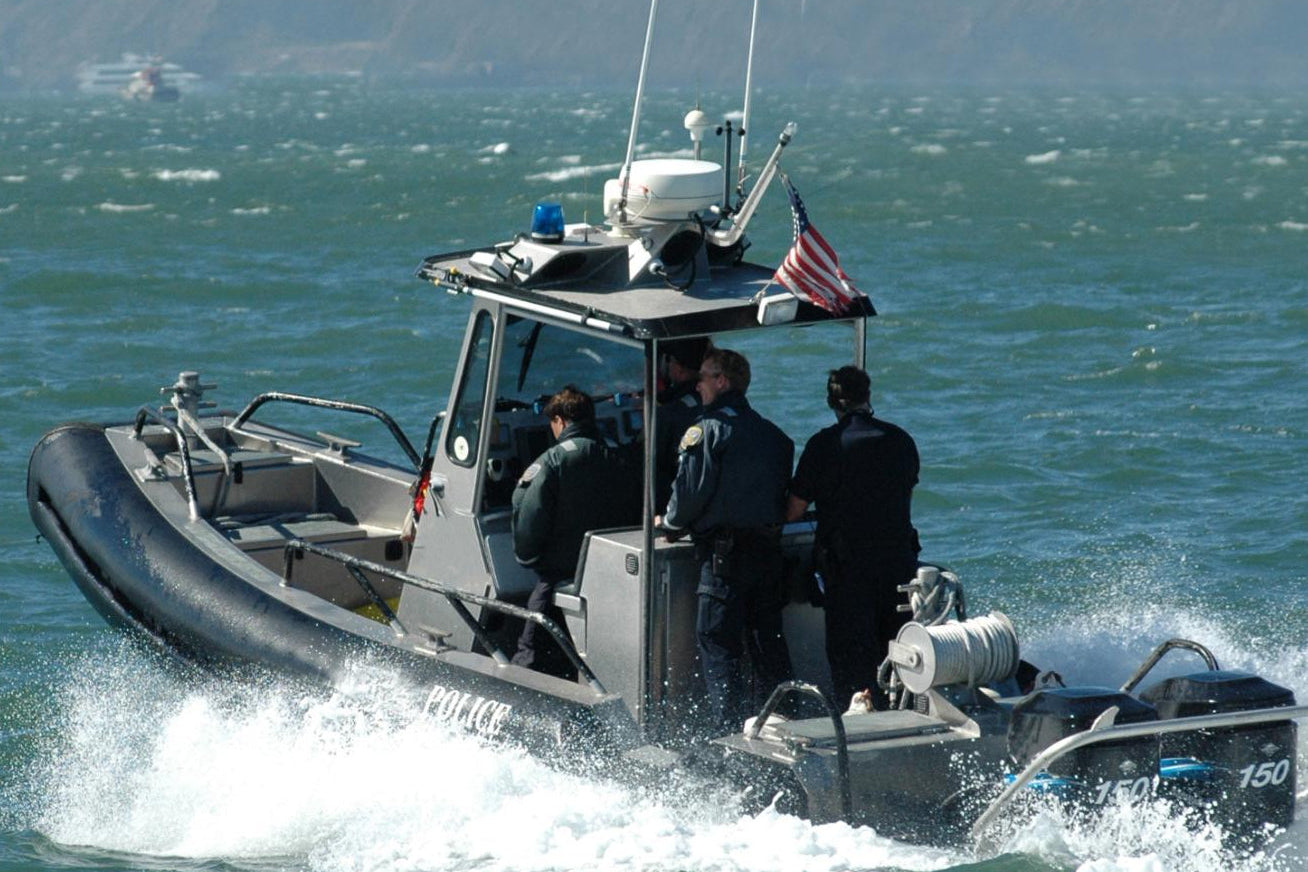 Police boat with officers on a body of water