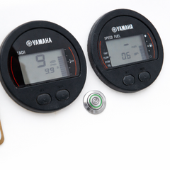 Yamaha marine instruments including a tachometer and speedometer on a white background